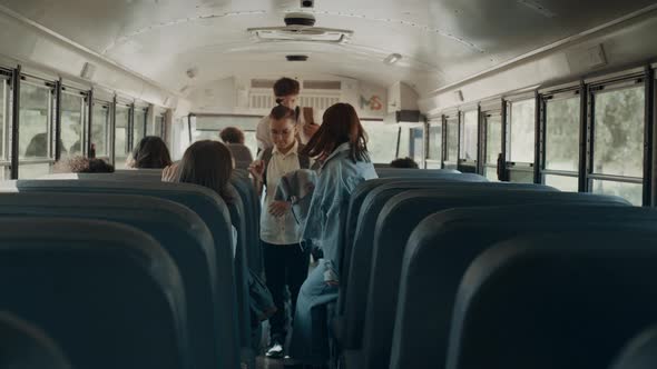 School Children Taking Seats in School Bus