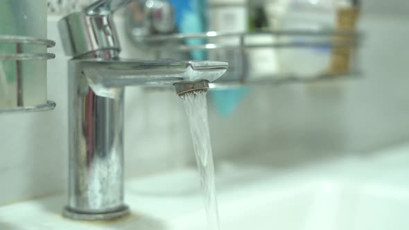 Closeup of Opening and Closing a Tap in a Sink