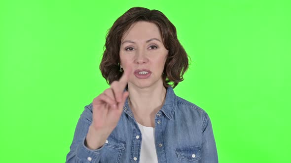 No Finger Sign By Old Woman on Green Chroma Key Background