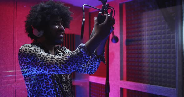 African american singer recording new music album inside boutique studio