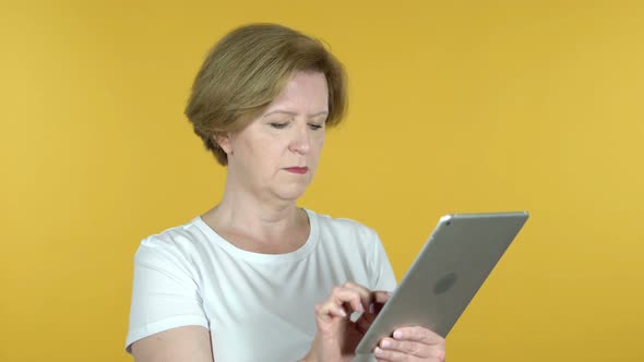 Old Woman Browsing Internet, Using Tablet