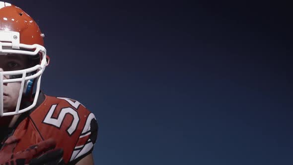 Half Face Portrait of Determined Professional American Football Player in Helmet Ready for Game and