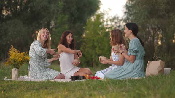 A Group of Young Beautiful Women in Nature in an Open Area Sculpt From Clay Use Tools Decorate