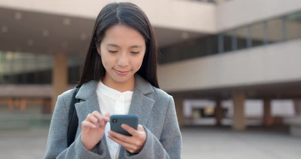 Young Business woman use of mobile phone at outdoor