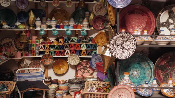 Traditional Moroccan Marrakech Market with Plates and Tajin Tagine. Handmade Ceramic Plates. Arabian