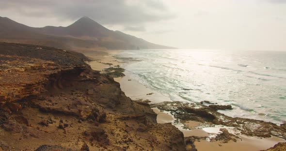 High Quality Footage of Cofete Beach in Fuerteventura with Waves Hitting the Endless Empty