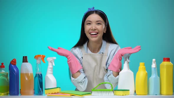 Smiling Housewife Presenting Detergents Assortment Cleaning Company Service