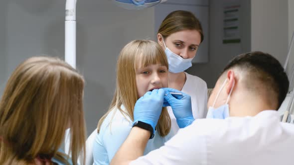 Little Girl Patient Visits a Specialist in a Dental Clinic