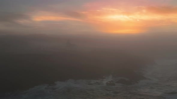 Light Bean Illuminating Thick Fog Above Ocean Aerial Point Cabrillo Lighthouse