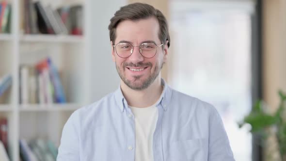 Portrait of Man in Glasses Talking on Online Video Call