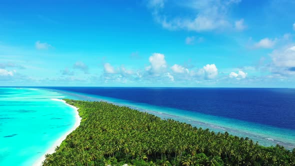 Wide birds eye island view of a summer white paradise sand beach and aqua blue water background in c