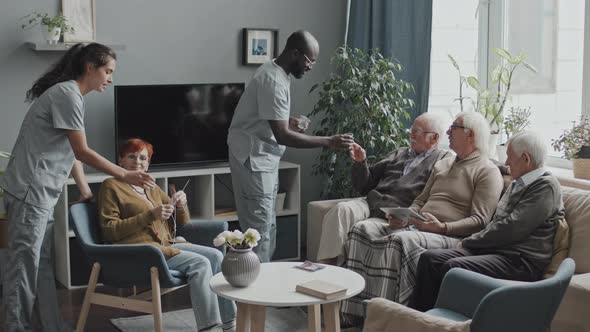 Nurses Bringing Medicines to Seniors at Nursing Home