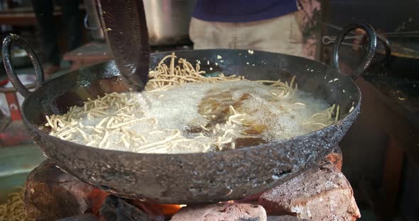 Indian Street Food Murukku Cooking in Rajasthan. Deep Fried Tasty Vegetarian Crispy Snack in Oil