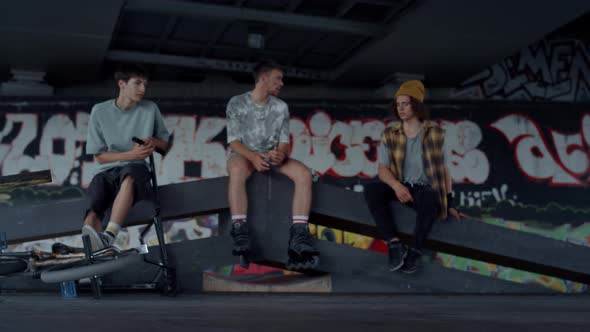 Millennial Boy Performing Skateboard Tricks Outdoors