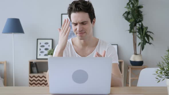 Upset Creative Man In Frustration for Results of Work on Laptop