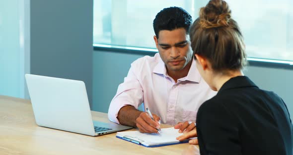 Recruiter taking interview of female candidate