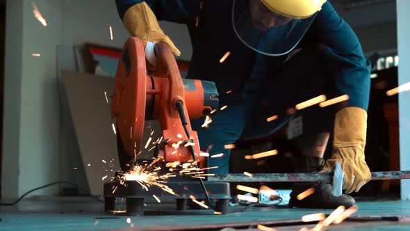 Professional Mechanic is Cutting Steel Metal