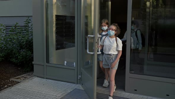 Schoolchildren Leave the School Building, On the Faces of Children, Protective Masks