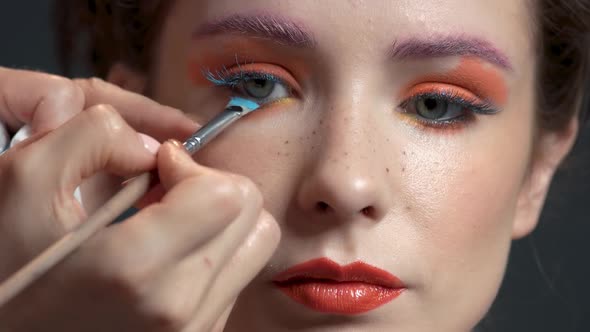 Visagist Applying Mascara Close Up.