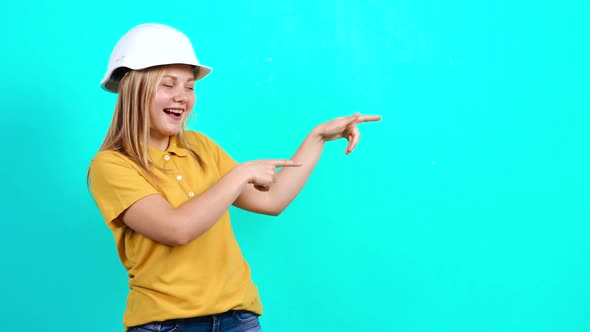 The Young Engineer Points with Her Hands on the Left Side of the Background, Recommending a Product