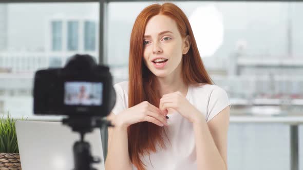 Girl Beauty Blogger Records Training Video Course on Digital Camera