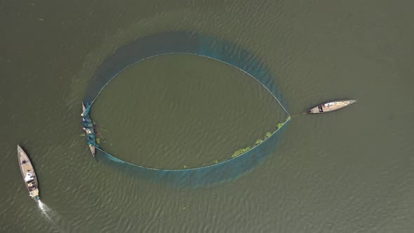 Aerial view of people working with fishing nets, Rajshahi, Bangladesh.