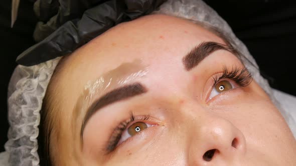 Correction of a Beautiful Aesthetic Shape of Eyebrows with Hot Wax and Special Tweezers