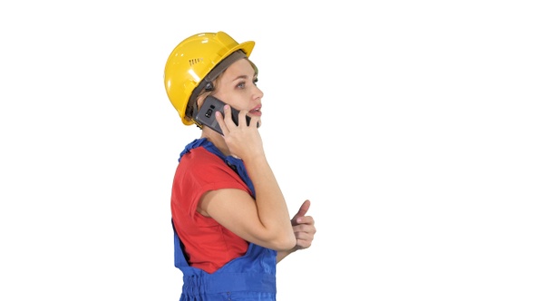 Beautiful young builder woman wear a yellow safety helmet