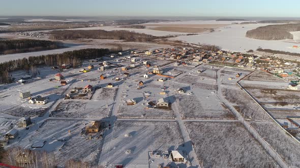 Aerial view of winter cottage village. 04