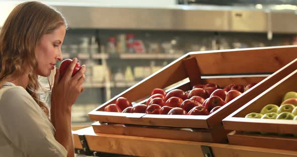 Woman Picking Out Fruit in Supermarket