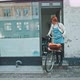 Young redhead woman ready to leave the house with a bike - VideoHive Item for Sale