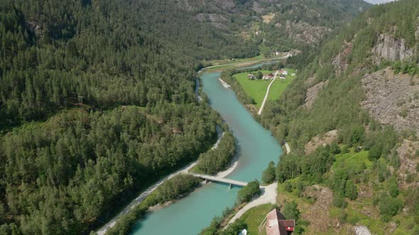 Drone Over Mountain Valley Of Forests And River