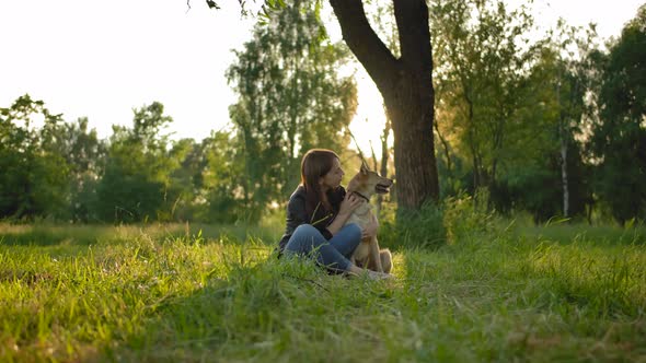 Tender Relationship Between the Mistress and Her Dog.