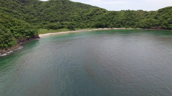 Little jungle beach with mountain