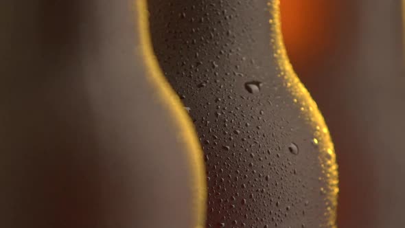 Three beer bottle rotating on black background