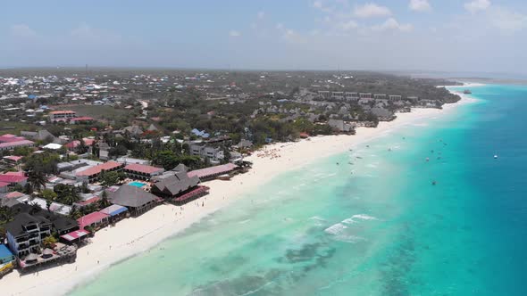 Aerial Paradise Sandy Beach with Turquoise Ocean and Luxury Hotels in Zanzibar