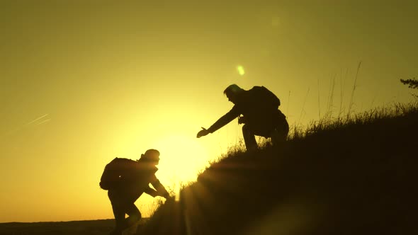 Travelers Climb the Cliff Holding Hand. Teamwork of Business People