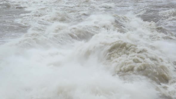 Flood waters chirning through Chaudiere Falls spillway.