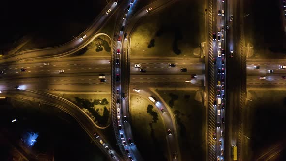Night Aerial Urban Traffic Road System. Busy Downtown 