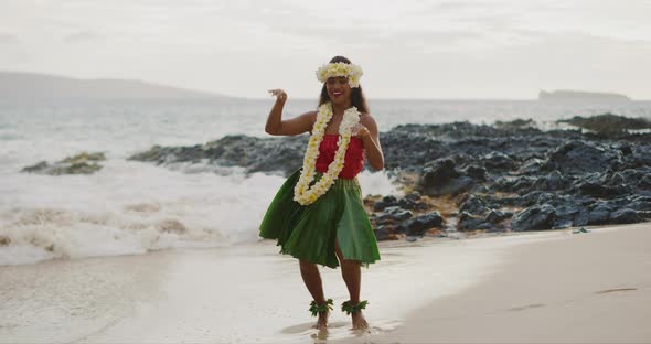 Woman performing Hawaiian hula on the beach