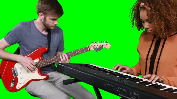 Musicians playing piano and guitar