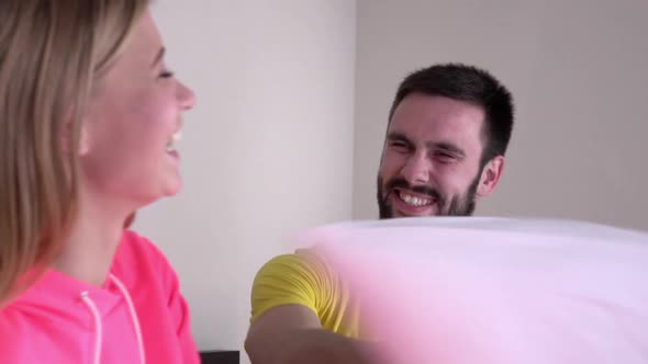 Young Couple in Bright Pajamas, Pillow Fight, Slowmotion