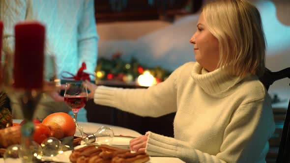 Ungrateful Woman Rejecting Gift Box Looking at Camera with Annoyed Facial Expression