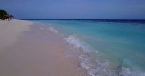 Beautiful aerial island view of a white sandy paradise beach and aqua turquoise water background in 