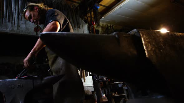 Blacksmith working on a iron rod