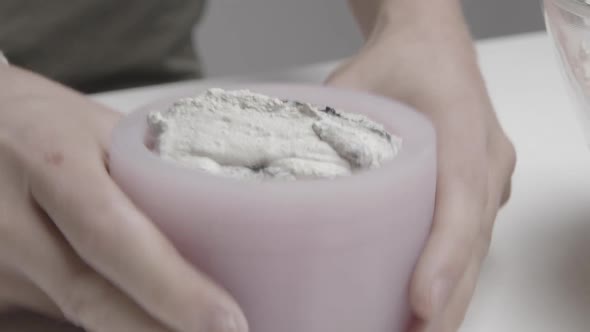 Concrete is Inserted Into a Silicone Mold to Create a Handmade Candle