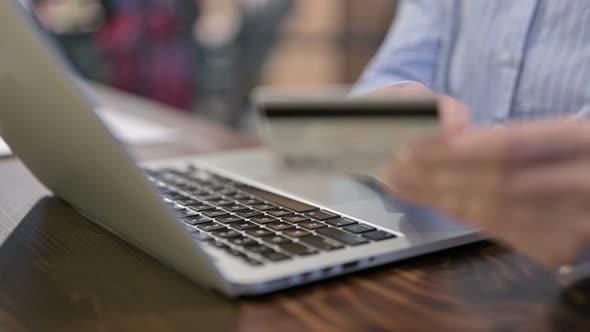 Close Up of Online Shopping on Laptop By Young Woman