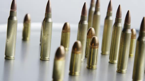 Cinematic rotating shot of bullets on a metallic surface - BULLETS 077