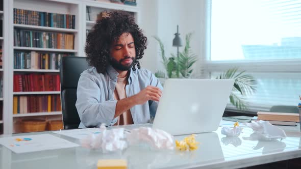 Young African American Man Engaged in Accounting Work and is Nervous