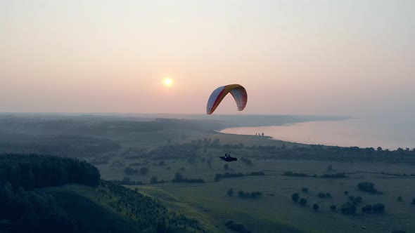 Parasailing Vehicle Is Flying High Above the Ground